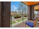 View of balcony featuring brick and wood architectural elements, outdoor seating, and neighborhood views at 3201 W 25Th Ave, Denver, CO 80211