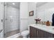 Modern bathroom featuring a glass-enclosed shower, a sleek vanity, and stylish finishes at 3201 W 25Th Ave, Denver, CO 80211