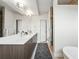 Luxurious bathroom featuring a double vanity, modern fixtures, and a walk-in shower at 3201 W 25Th Ave, Denver, CO 80211