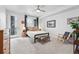 Bright bedroom with a modern ceiling fan, decor, and an exterior door leading to the outside at 3201 W 25Th Ave, Denver, CO 80211