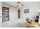Bedroom featuring a built-in murphy bed with built in shelves and a home office area at 3201 W 25Th Ave, Denver, CO 80211