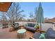 Enjoy outdoor living on the spacious deck with stylish furniture and an umbrella for shade at 3201 W 25Th Ave, Denver, CO 80211