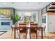 Dining area features a modern light fixture, large window, and hardwood floors at 3201 W 25Th Ave, Denver, CO 80211