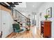 Inviting entryway with hardwood floors, modern staircase, and stylish decor at 3201 W 25Th Ave, Denver, CO 80211