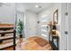 Welcoming foyer boasts hardwood floors, a decorative rug, and an entryway table at 3201 W 25Th Ave, Denver, CO 80211