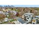 Aerial view of neighborhood showcasing modern homes with city views and mature trees at 3201 W 25Th Ave, Denver, CO 80211