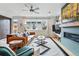 Cozy living room with a fireplace, large windows, and stylish decor and hardwood floors at 3201 W 25Th Ave, Denver, CO 80211
