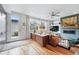 Bright living room with a fireplace, large windows, stylish decor and hardwood floors at 3201 W 25Th Ave, Denver, CO 80211
