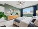 Comfortable main bedroom showcases modern decor, a large window, and ample natural light at 3201 W 25Th Ave, Denver, CO 80211