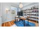 Bright home office with a large window, modern desk, and built-in shelving at 3201 W 25Th Ave, Denver, CO 80211