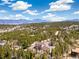 Beautiful mountain home enveloped by lush trees, offering a peaceful retreat with scenic vistas at 1140 Indian Peak Rd, Golden, CO 80403