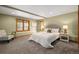 Charming bedroom with soft carpet, natural light and stylish furniture for a cozy retreat at 1140 Indian Peak Rd, Golden, CO 80403