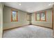Inviting bedroom with natural light, neutral colors, and plush carpet at 1140 Indian Peak Rd, Golden, CO 80403