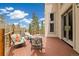 Beautiful outdoor deck features ample seating, a wood railing, and scenic views of the surrounding nature at 1140 Indian Peak Rd, Golden, CO 80403