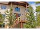 Elegant home with a covered front porch and meticulous landscaping for exceptional curb appeal at 1140 Indian Peak Rd, Golden, CO 80403