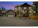 Beautiful home with stone accents, a three-car garage, and inviting front porch at 1140 Indian Peak Rd, Golden, CO 80403