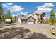 Expansive property with a three-car garage, RV parking, and landscaped surroundings at 1140 Indian Peak Rd, Golden, CO 80403