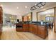 Open kitchen layout with a stone accent wall and easy access to the dining and living areas at 1140 Indian Peak Rd, Golden, CO 80403