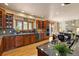 Well-appointed kitchen with custom wood cabinets, a cooktop island, and stainless steel appliances at 1140 Indian Peak Rd, Golden, CO 80403