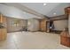 Large living space with tile floors, bright window, and space for a dining or recreation area at 1140 Indian Peak Rd, Golden, CO 80403