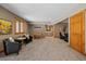 Spacious basement living area with comfortable seating and recreation area with a foosball table at 1140 Indian Peak Rd, Golden, CO 80403