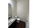 Half bathroom with granite countertop and white fixtures at 14883 E Crestridge Dr, Centennial, CO 80015