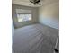 Spacious carpeted bedroom features a large window offering lots of natural light at 14883 E Crestridge Dr, Centennial, CO 80015