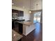 Modern kitchen with stainless steel appliances, large island, and sleek finishes at 14883 E Crestridge Dr, Centennial, CO 80015