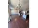 Open-concept living room with hardwood floors, fan, and staircase at 14883 E Crestridge Dr, Centennial, CO 80015