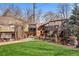 Backyard showcasing a custom wood patio cover, and green lawn at 10874 Pearl Ct, Northglenn, CO 80233