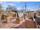 Backyard featuring raised garden beds and detached shed at 10874 Pearl Ct, Northglenn, CO 80233