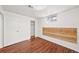 Bedroom with hardwood floors, white walls, and windows for natural light at 10874 Pearl Ct, Northglenn, CO 80233