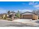 Charming one-story home with brick siding, a spacious two-car garage, and a well-manicured front yard at 10874 Pearl Ct, Northglenn, CO 80233