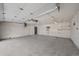 Spacious two car garage with painted walls and concrete floor; ready for parking and storage at 10874 Pearl Ct, Northglenn, CO 80233