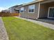Lush green backyard with a well-maintained lawn and convenient sliding door access at 14758 Normande Dr, Mead, CO 80542