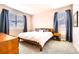 Relaxing bedroom with neutral tones, plush carpet, and ample natural light from large windows at 14758 Normande Dr, Mead, CO 80542