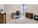 Neutral bedroom with carpet, a window, a desk, and wood furnishings, ideal for a home office at 14758 Normande Dr, Mead, CO 80542