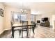 Welcoming dining area with access to the backyard and open to the cozy living room at 14758 Normande Dr, Mead, CO 80542