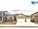Charming single Gathering home with a two car garage, stone accents, and well manicured lawn at 14758 Normande Dr, Mead, CO 80542