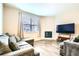 Cozy living room featuring a fireplace and stylish wood flooring at 14758 Normande Dr, Mead, CO 80542