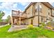 Inviting backyard with a multi-level deck and patio, perfect for enjoying the outdoors at 9816 Kalispell St, Commerce City, CO 80022