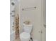 Bathroom featuring a shower and toilet with a floral arrangement on top at 9816 Kalispell St, Commerce City, CO 80022