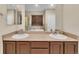 Bathroom with double sinks, a soaking tub, and a separate shower at 9816 Kalispell St, Commerce City, CO 80022