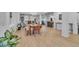 Bright and airy dining room featuring hardwood floors and an open layout, perfect for entertaining at 9816 Kalispell St, Commerce City, CO 80022