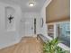 Bright Foyer with front door, ceramic floors, a bench, and a plant for added comfort at 9816 Kalispell St, Commerce City, CO 80022