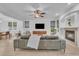 Living room boasts a fireplace, modern furnishings, and seamless access to a patio at 9816 Kalispell St, Commerce City, CO 80022