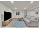 Living room with a comfortable couch, entertainment center and decor at 9816 Kalispell St, Commerce City, CO 80022