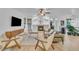 Spacious living room featuring a fireplace, modern furnishings, and hardwood floors at 9816 Kalispell St, Commerce City, CO 80022