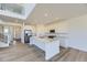 Modern kitchen with white cabinets, stainless steel appliances, and large island with sink at 2968 S Poppy St, Morrison, CO 80465