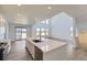 Open concept kitchen with quartz countertops, stainless appliances, and seamless flow to living area at 2968 S Poppy St, Morrison, CO 80465